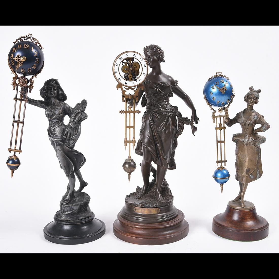 Three Figural Swinger Clocks. (1 of 2)