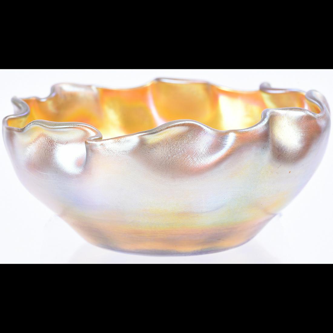 Steuben Gold Aurene Fluted Bowl.: Steuben Gold Aurene Fluted Bowl. Spuriously engraved L. C. T. marks to the underside. {Approximate dimensions: 3 high x 6 1/2 inches diameter.}. Condition: Minimal wear.