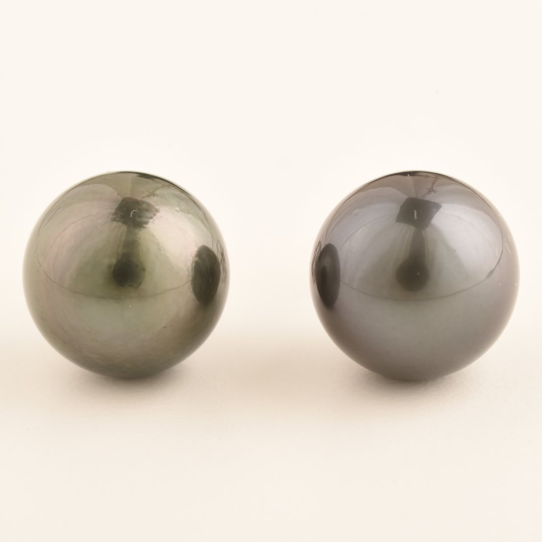 Pair of Tahitian Cultured Pearl, 18k White Gold Stud: Pair of Tahitian Cultured Pearl, 18k White Gold Stud Earrings. Each featuring one round black Tahitian cultured pearl measuring approximately 13.2 mm and 13.1 mm, set in an 18k white gold stud mountin