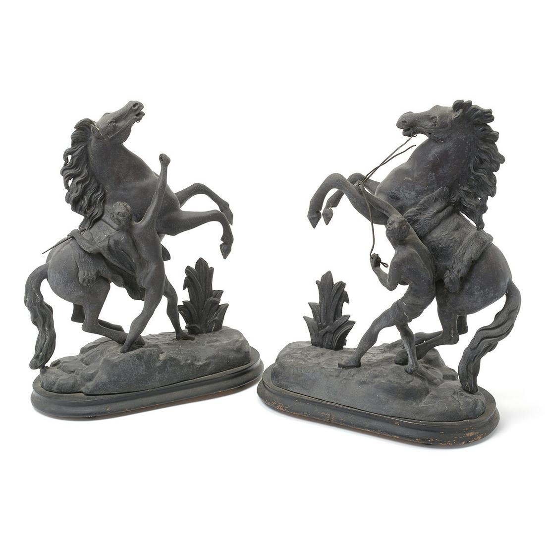 Pair of Black Metal Horse Figures.: Pair of Black Finish Metal Horse Figures._x000B_ Each horse on hind legs with a handler beside it. One figure missing the reins, on black painted wood bases. {Approximate dimensions: 16 1/2 high x 13 