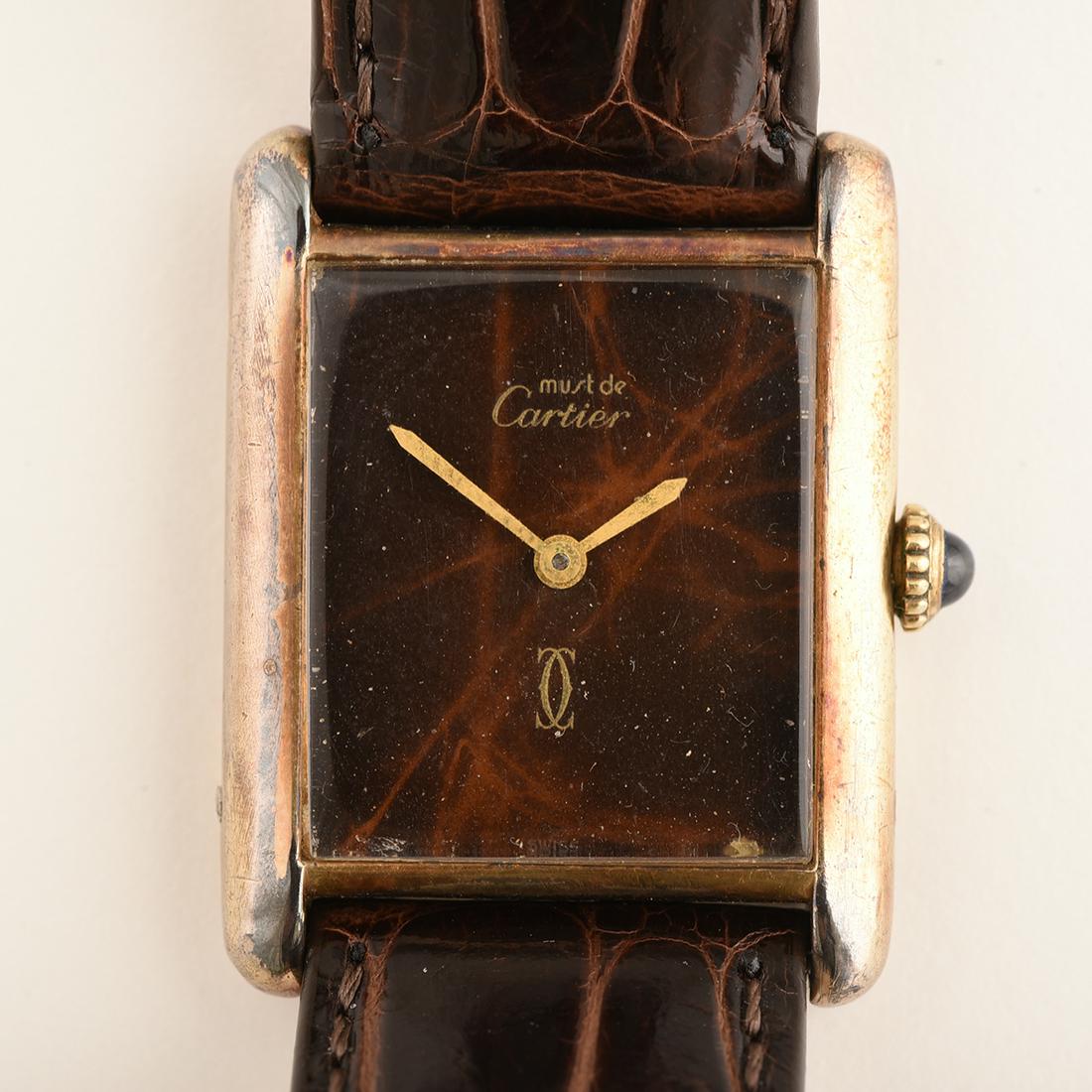 Cartier Must De Vermeil, Leather Wristwatch.: Cartier Must De Vermeil, Leather Wristwatch. DIAL: Rectangle, tiger's eye motif, gold baton hands, Must de Cartier, Swiss. MOVEMENT: Manual wind (not opened). CASE: Rectangle/tank, vermeil/925, four s