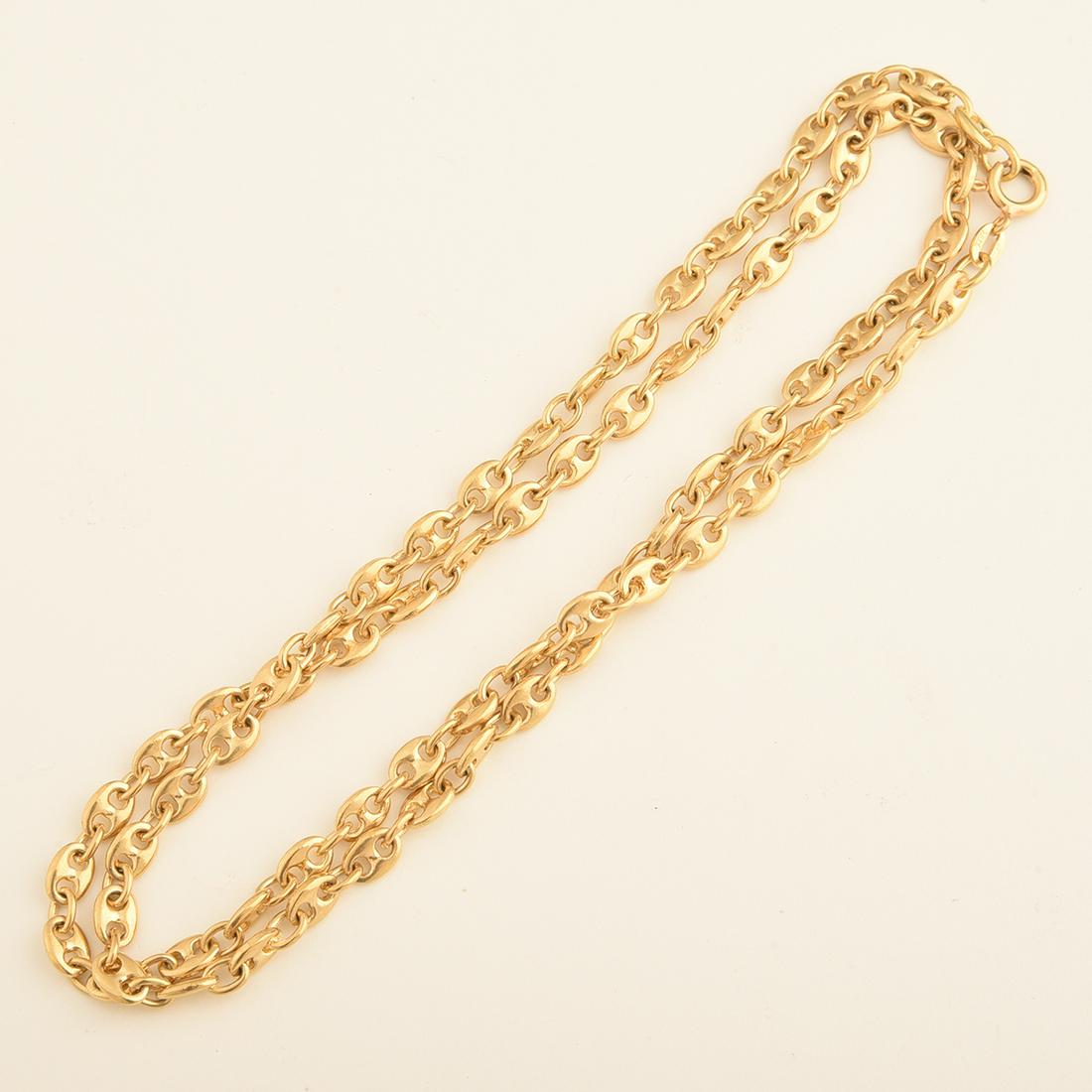 18k Yellow Gold Neck Chain.: 18k Yellow Gold Neck Chain. The 18k yellow gold Gucci link measuring approximately 5 mm in width, completed by a spring ring clasp, forming a 23 1/4 inch neck chain. {Gross Weight: 22.3 dwts}
