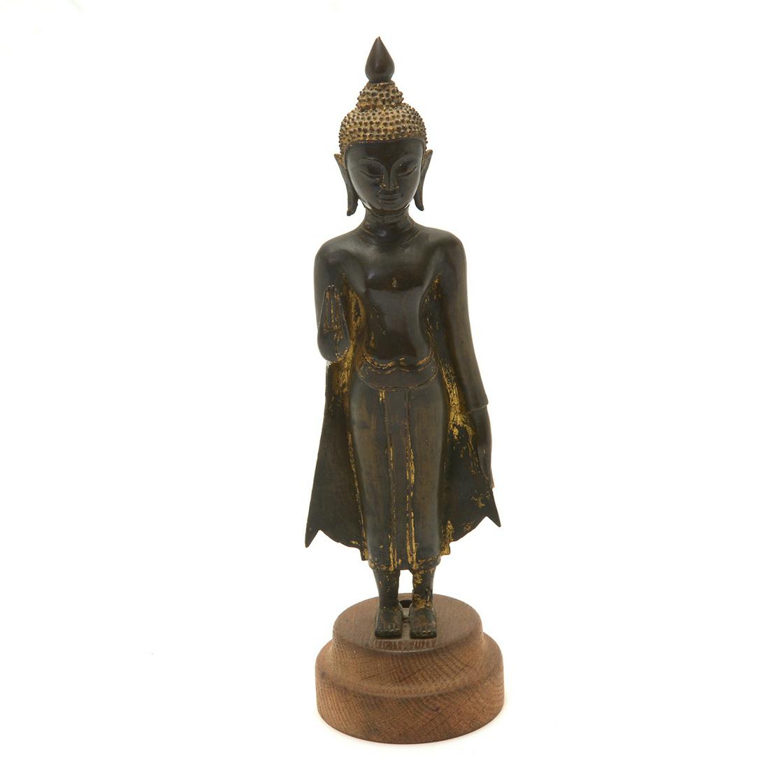 Thai Gilt Bonze Standing Bodhisattva: Thai Gilt Bonze Standing Bodhisattva. The figure is cast standing with his right hand raised in abhayamudra, the left stretched along his body, with serene expression and downcast eyes, support on cir