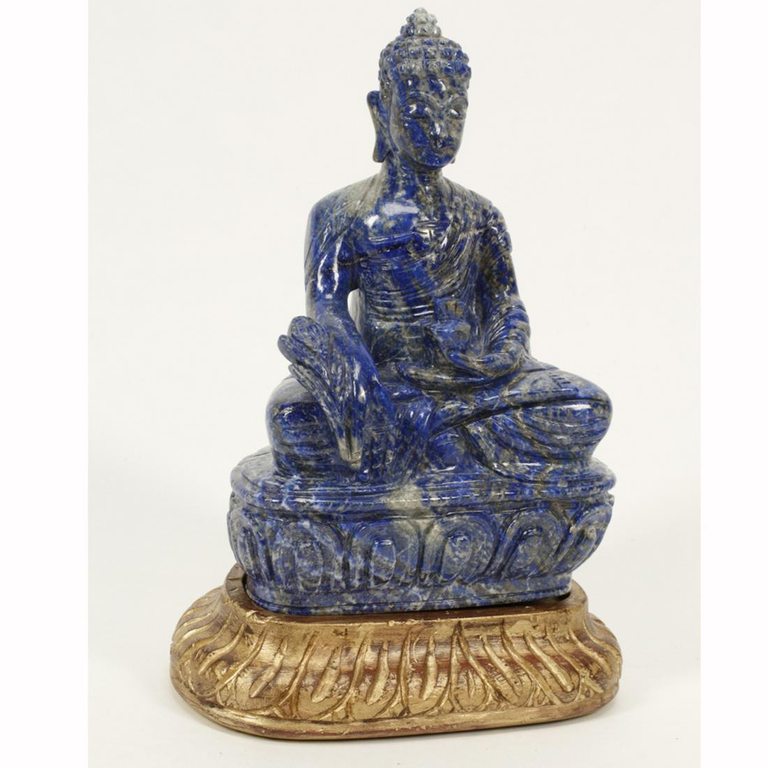Chinese Cavred Lapis Lazuli Seated Buddha on Gilded: Chinese Cavred Lapis Lazuli Seated Buddha on Gilded Base. Seated in Padmasana on a lotus plinth, clad in a loose-fitting robe, his right hand lowered in Varada Mudra and his left hand holding a cup in