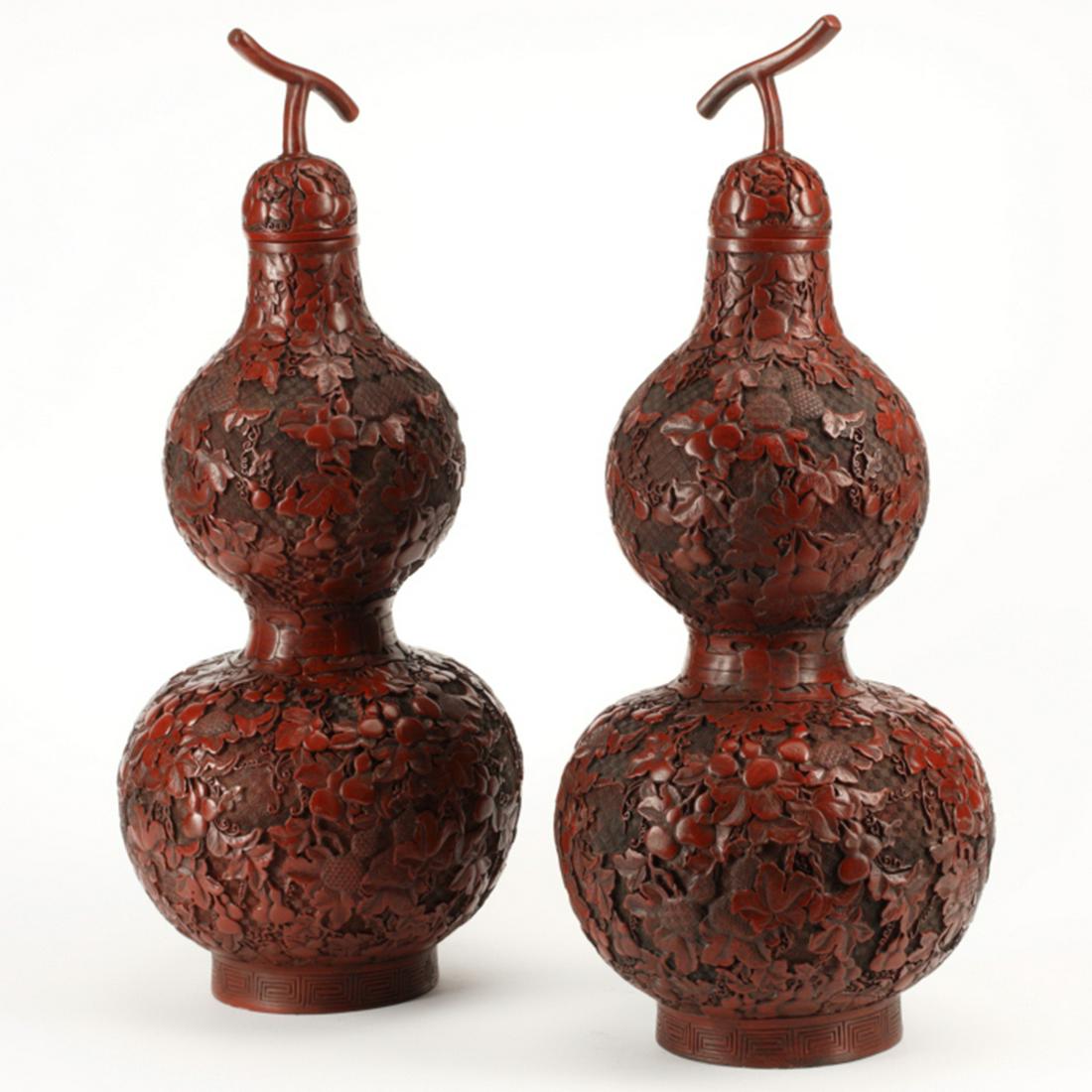 Pair of Chinese Cinnabar Double Gourd Vases with: Pair of Chinese Cinnabar Double Gourd Vases with Covers. The exterior meticulously carved in relief with leafy veins bearing double gourds against a dense diaper pattern of concentric squares, knot de