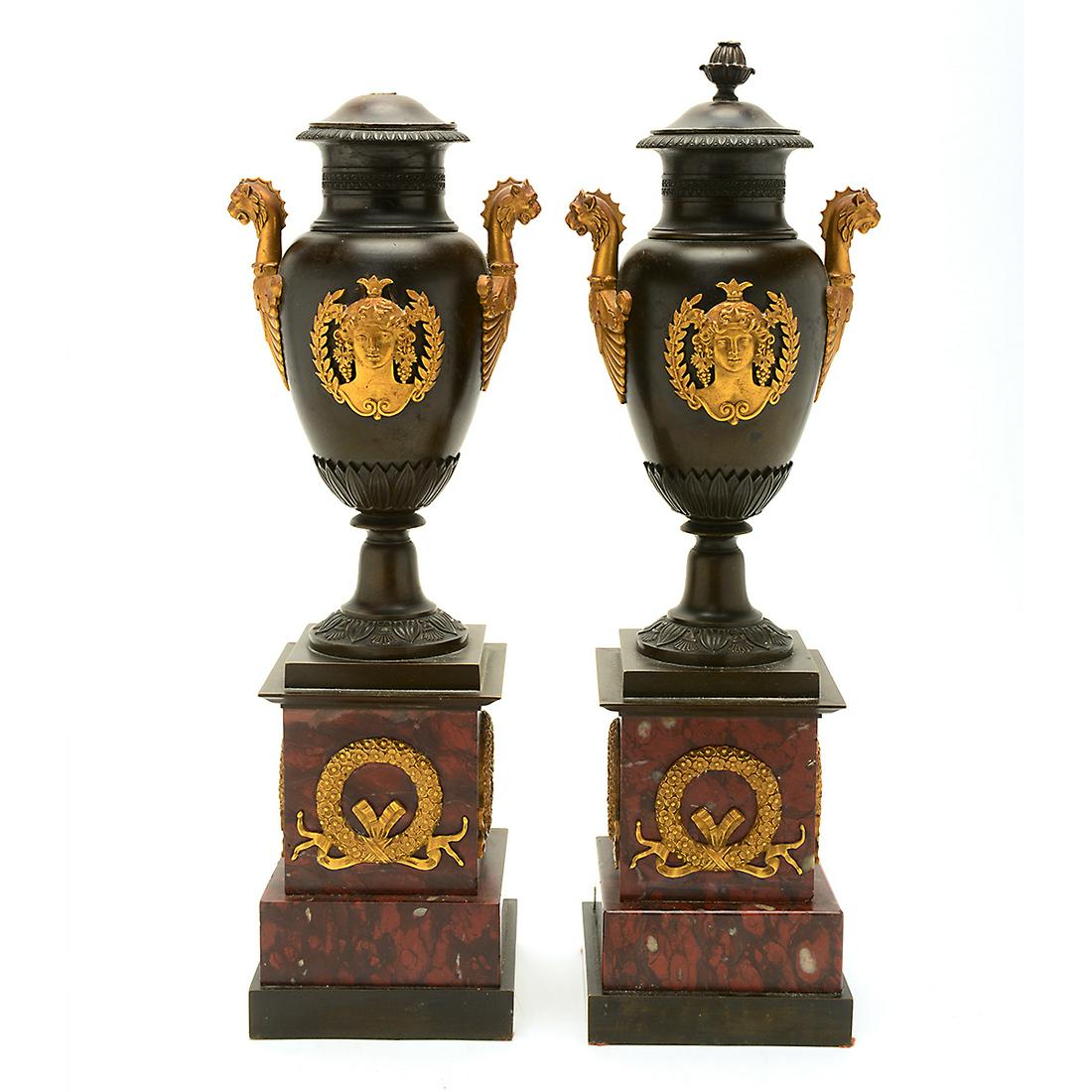 Pair of French Beaux Arts Empire Style Bronze: Pair of French Beaux Arts Empire Style Bronze Cassoulets. With ormolu mounts and red marble bases. {Approximate dimensions: 15 3/4 high x 4 1/4 inches wide and deep.}. Condition: Both finials with app