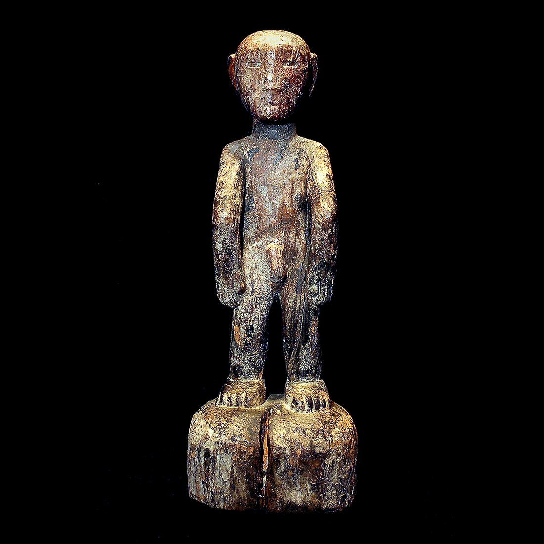 19th Century Ifugao Tribal Standing Bulul Statue.: 19th Century Ifugao Tribal Standing Bulul Statue. Collection sticker to the back underside, that reads "1326a. Red sticker to underside reads "David Howard Tribal Art." {Approximate dimensions: 23 1/4