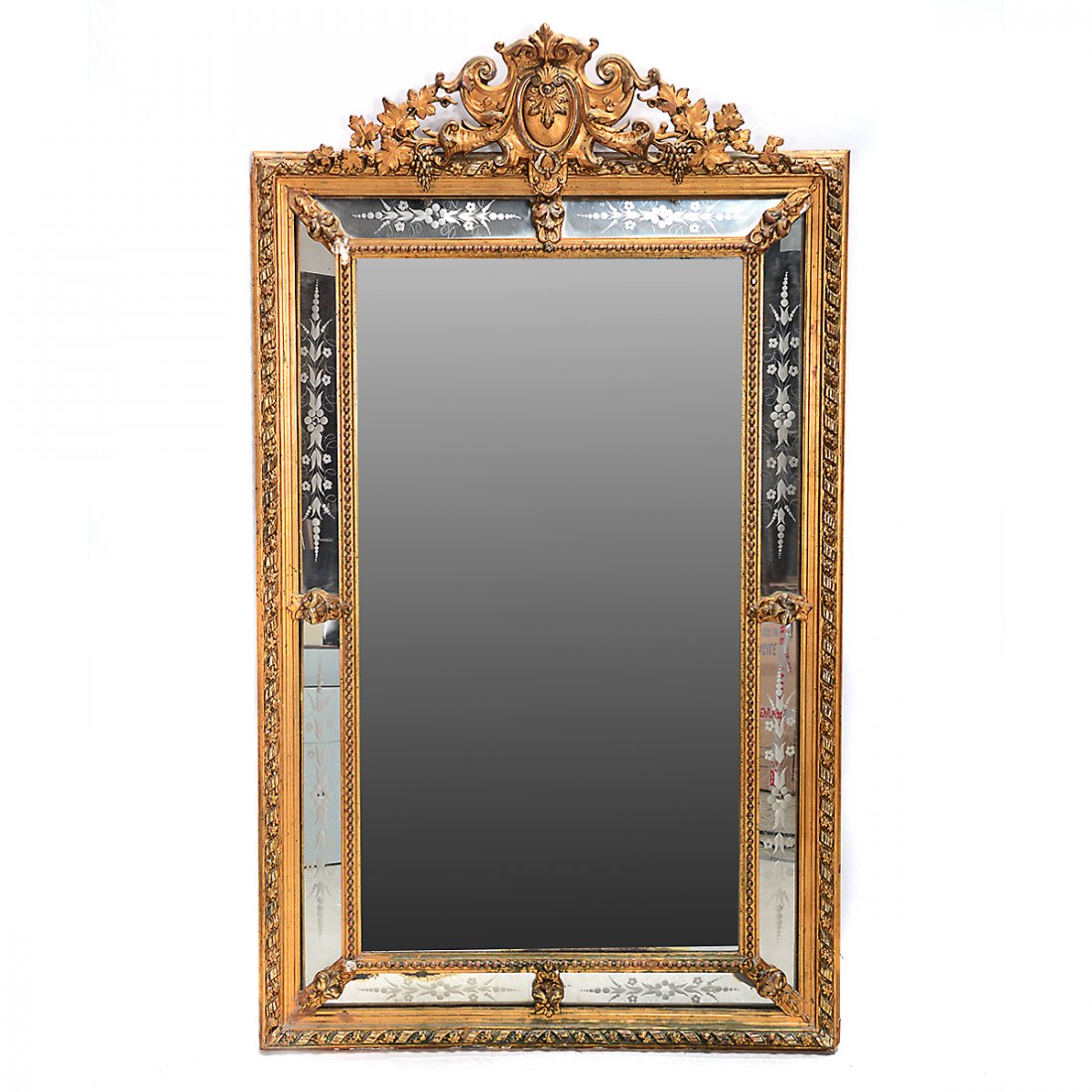 Carved Gilt-Wood Wall Mirror with Etched Mirrored: Carved Gilt-Wood Wall Mirror with Etched Mirrored Frame. Parcel silver-gilt accents; the mirrored panels around the frame with reverse etched flowers. {Approximate dimensions: 68 high x 40 inches wide