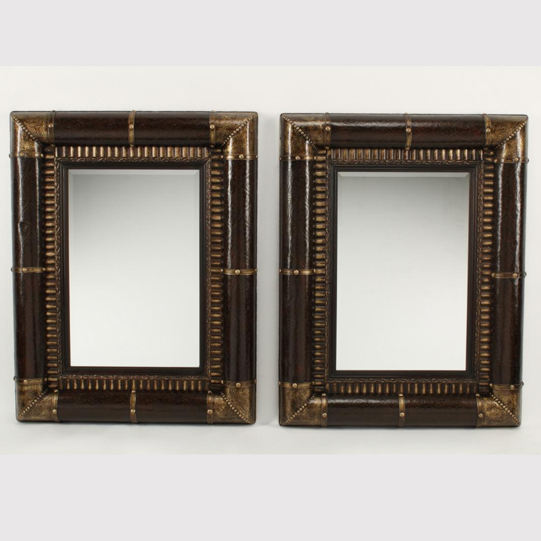 Pair of Portuguese Style Embossed Leather Mounted: Pair of Portuguese Style Embossed Leather Mounted Mirrors. {Approximate dimensions: 47 1/2 high x 36 1/2 inches wide.}. Condition: Patinated finish, light wear overall.
