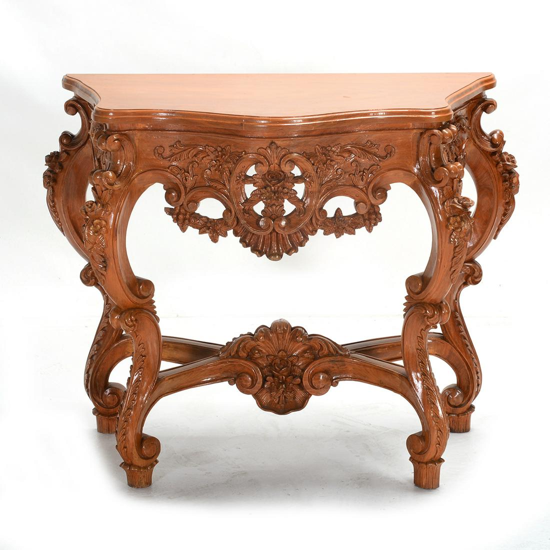 French Rococo Style Golden Oak Console Table: French Rococo Style Golden Oak Wood Console Table. Carved with various scrolls, foliate, and floral carvings. {Approximate dimensions: 31 1/4 high x 35 3/4 wide x 18 inches deep.}. Condition: Minor su
