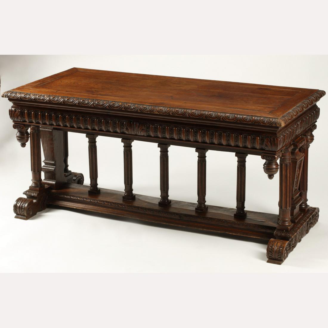 19th Century Renaissance Revival Side Table.: 19th Century Oak Renaissance Revival Table. Carved decoration throughout. {Approximate dimensions: 30 high x 63 wide x 30 inches deep.}. Condition: Minor surface wear, cracking to one surface corner. 