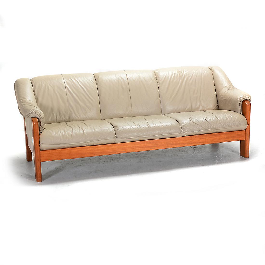 Norwegian Ekornes Sofa.: Norwegian Ekornes Sofa. Beige leather upholstery, wood frame. Ekornes tag to the side. {Approximate dimensions: 31 high x 82 wide x 35 inches deep.}. Condition: Leather with some wrinkling and wear, w