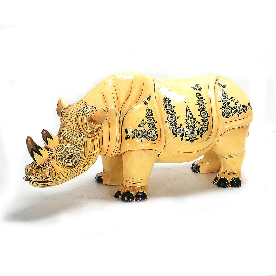 Sergio Bustamante "Rhino" papier mache: SERGIO BUSTAMANTE (Mexican b. 1949) "Rhinoceros" Papier mache. 27 x 57 x 20 inches. Signed and numbered along the left shoulder: Sergio Bustamante 28/100.