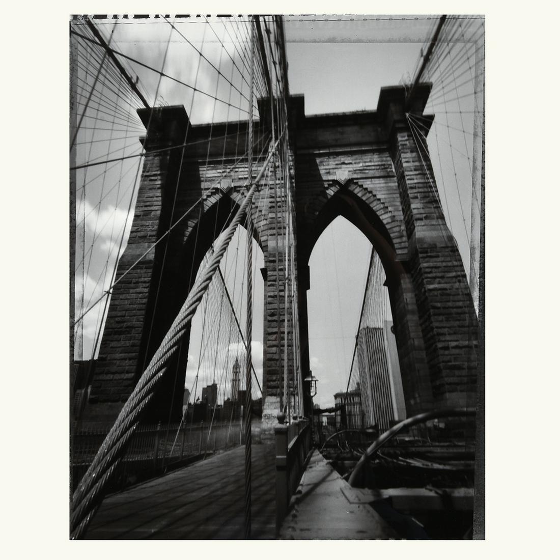 Tom Baril "Brooklyn Bridge" toned gelatin silver print: TOM BARIL (American b. 1952) "Brooklyn Bridge" Toned silver gelatin print. Sight: 23 x 18 inches; Frame: 29 5/8 x 23 3/8 inches. Signed, titled and dated verso; signed on mount recto 7/15. Provenance: