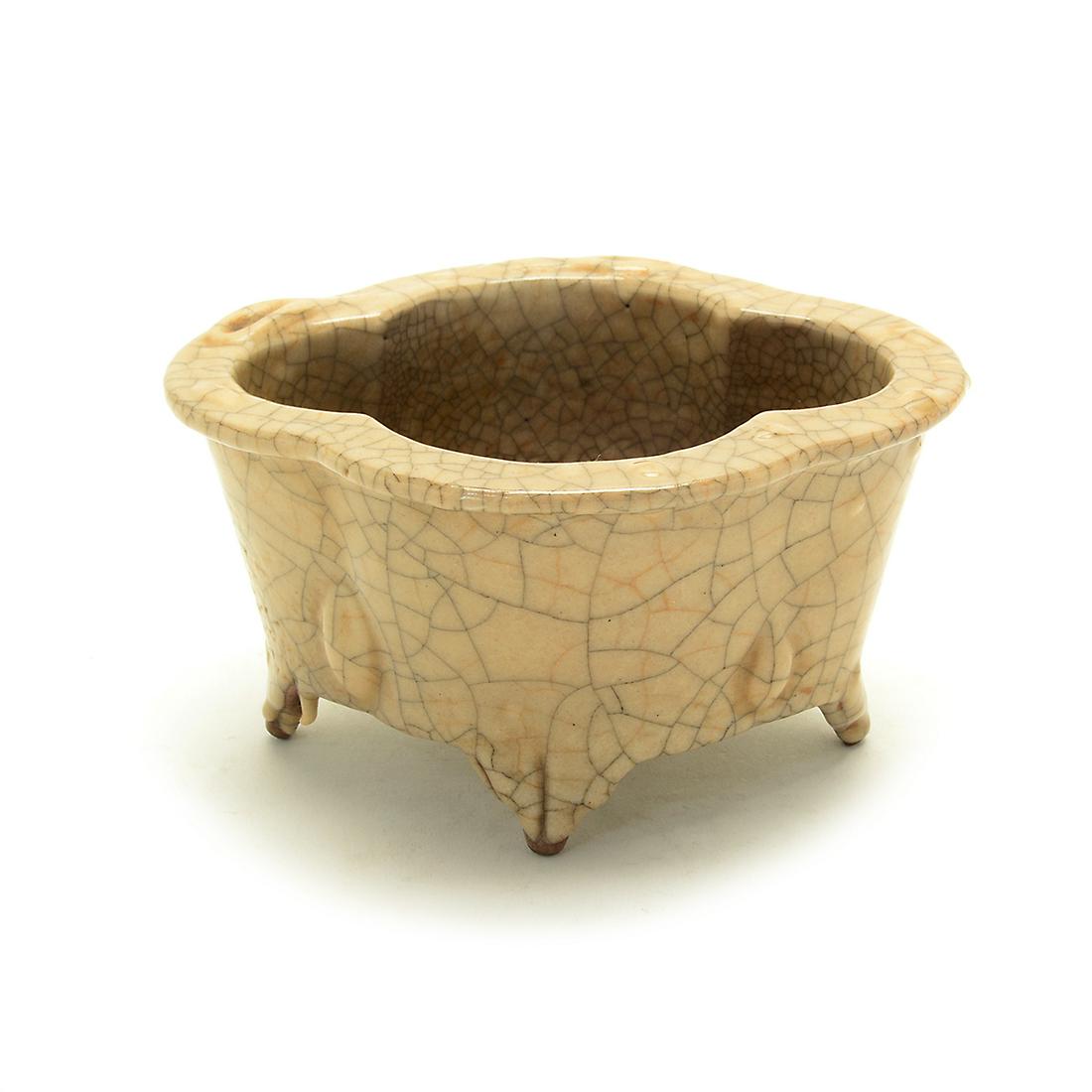 Chinese Ge-Type Bulb Planter.: Chinese Ge-Type Bulb Planter. Of oval shape with lobed sides and everted rim supported on four legs, covered overall in a thick glaze suffused with iron and golden crackles, spur marks in the interior