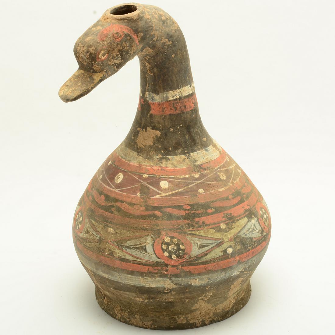 Chinese Han Dynasty Duck-Shaped Terracotta Painted: Chinese Han Dynasty Duck-Shaped Terracotta Painted Vessel. The pear-shaped body surmounted on a wide, slightly splayed foot and sweeping up to a curved neck and the head of duck pierced with a circula