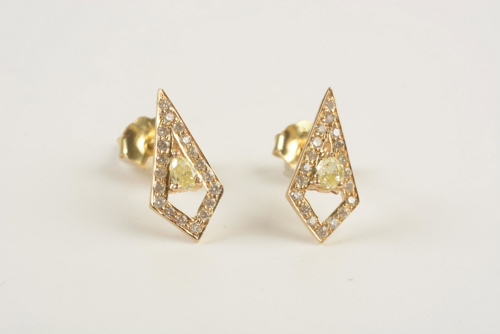 Pair of Diamond, 18k Yellow Gold Earrings.: Pair of Diamond, 18k Yellow Gold Earrings. Each featuring one pear-cut yellow diamond, surrounded by full-cut diamonds, set in an 18k yellow gold open shield shaped mounting measuring approximately 14