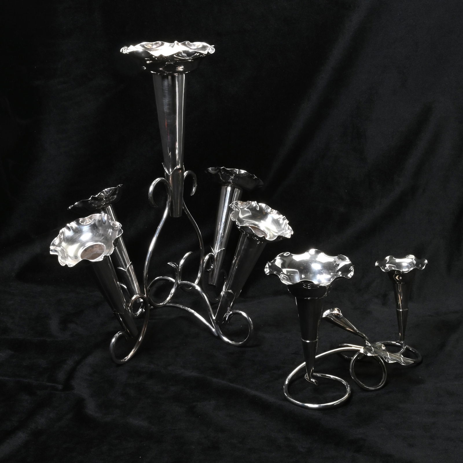 Two Silver Plate Epergnes, Mappin & Webb's and Hardy: Two Silver Plate Epergnes, Mappin & Webb's and Hardy Brothers. The Mappin & Webb piece with five scalloped trumnpet forms; the Hardy Brothers piece with leaf motif, two trumpet forms. Mappin & Webb ma