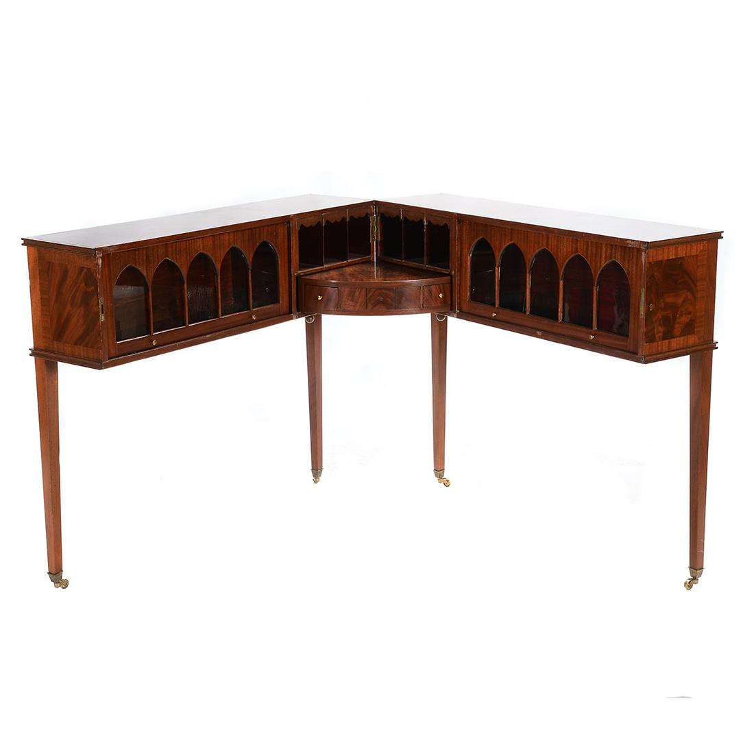 Brian Tolle Mahogany Scissoring Desk.: Brian Tolle Mahogany Scissoring Desk. Opens from the middle into an 'L' form; with glazed barrister bookcases to either side, and a small writing surface with three drawers; the center drawer divided