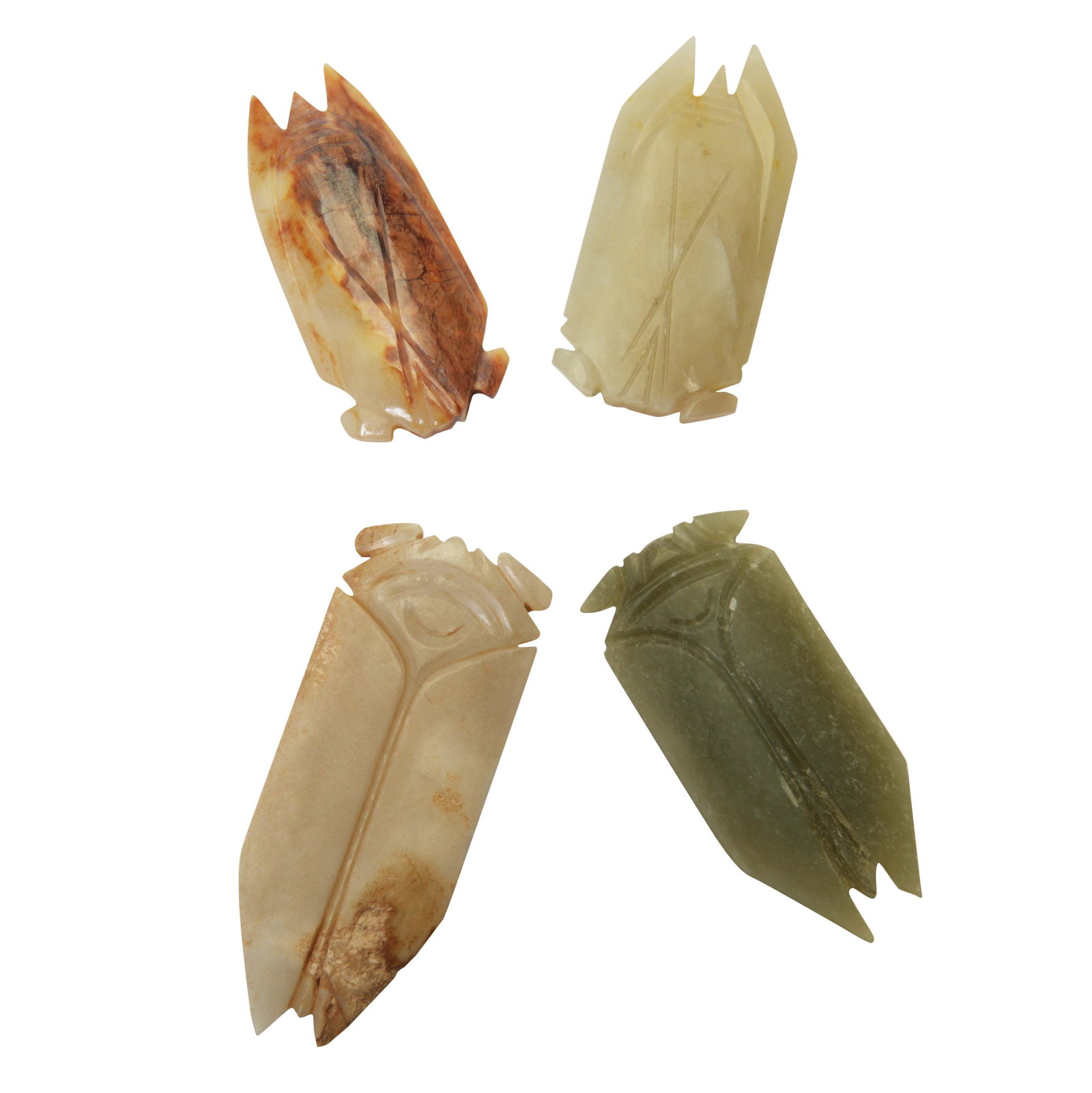 Four Han Style Carved Cicadas.: Four Han Style Carved Hardstone Cicadas. The first of dark greenish-gray stone with white speckles; the second of pale greenish-white stone; the third of grayish-white stone with large areas of calcif