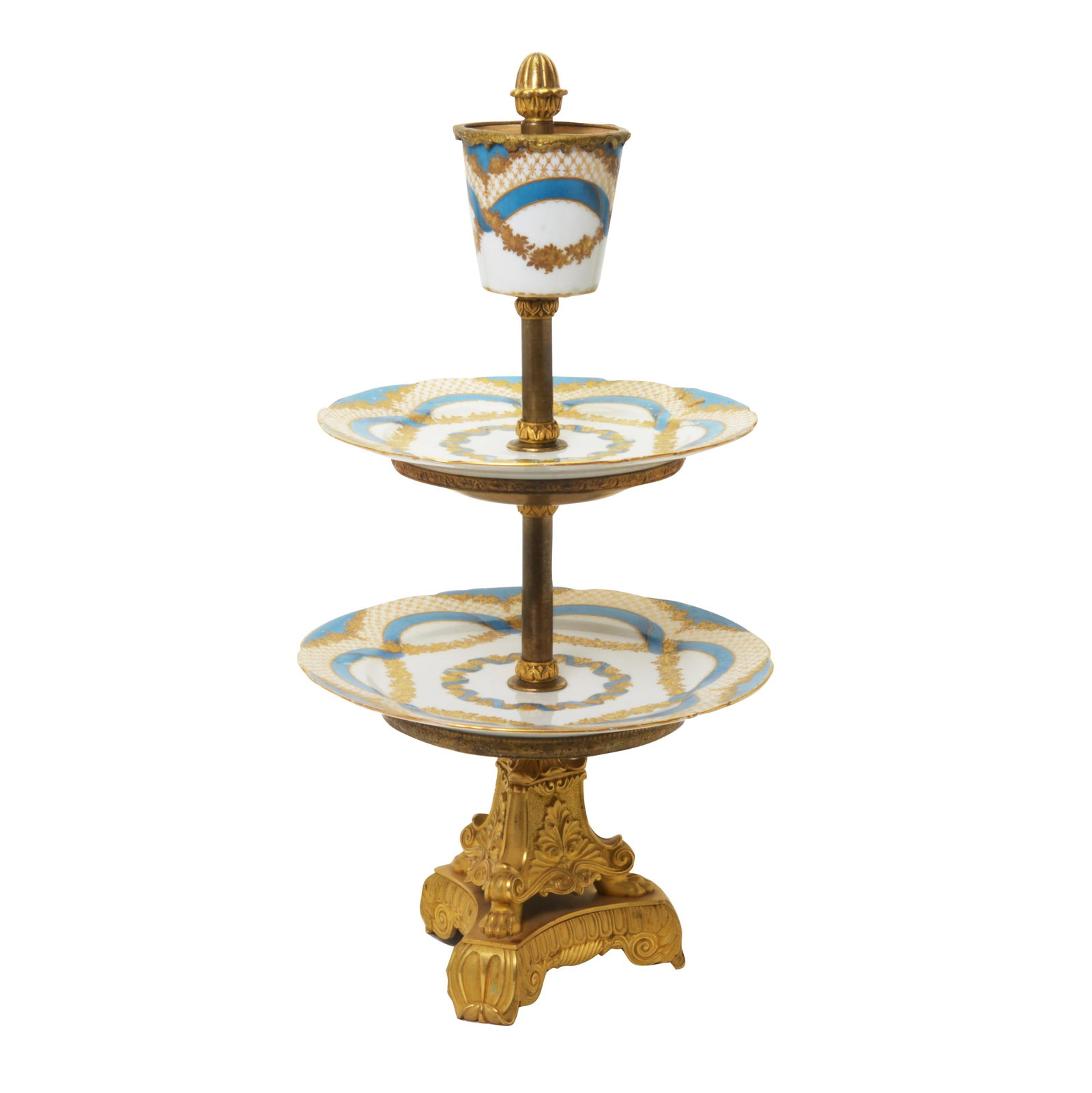 French Ormolu and Sevres Style Porcelain Plateau: French Ormolu and Sevres Style Porcelain Plateau. The gilt-bronze base of tripodal form, designed as monopedia supporting shield shaped panels, above a gadrooned and scroll foot base. The three tiers 