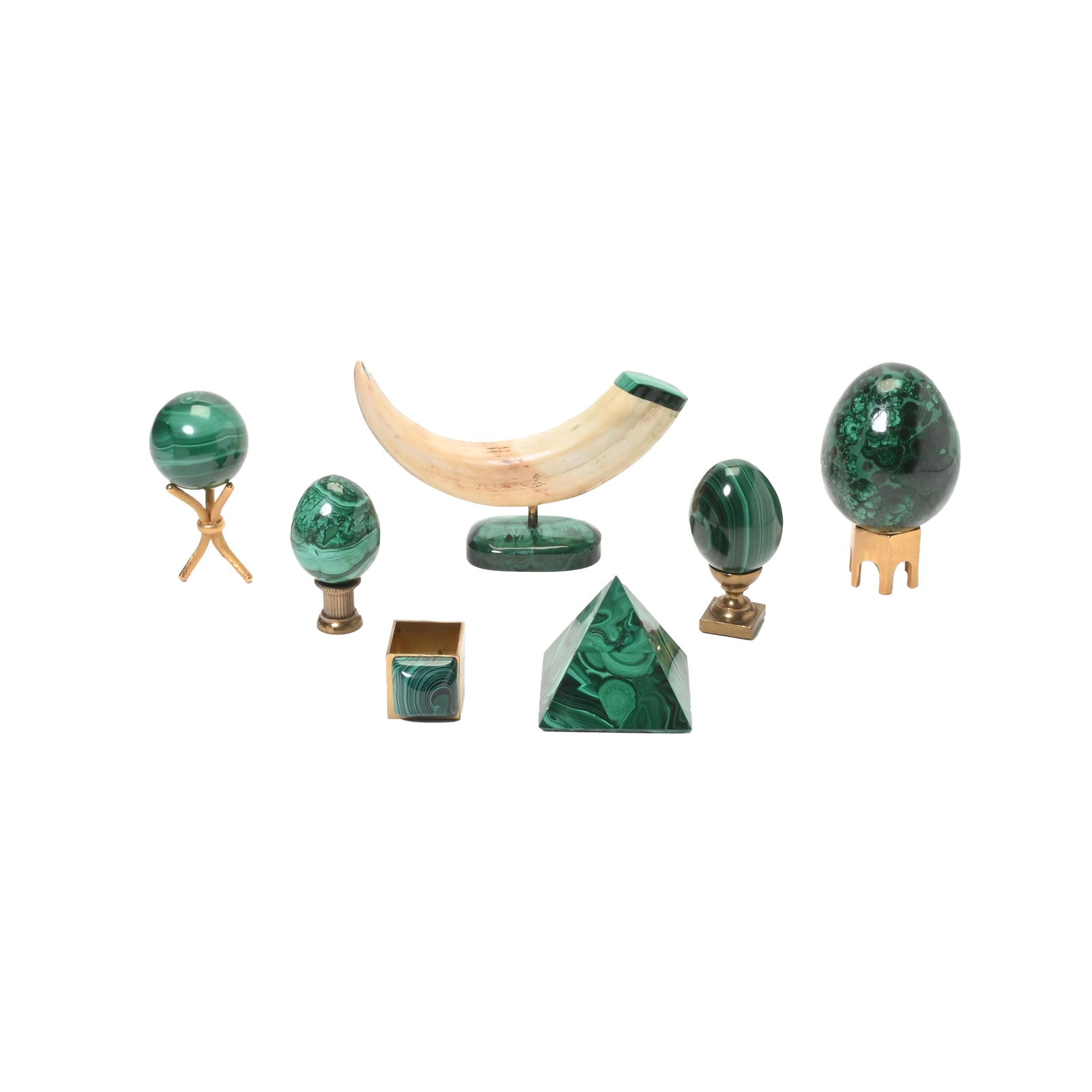 Collection of Malachite Desk Articles Including Tusk.: Collection of Malachite Desk Articles Including Tusk. Four of egg form, with gilt brass stands of various shapes and styles. One pyramidal. One gilt brass ring-form paperweight with domed slab to top.