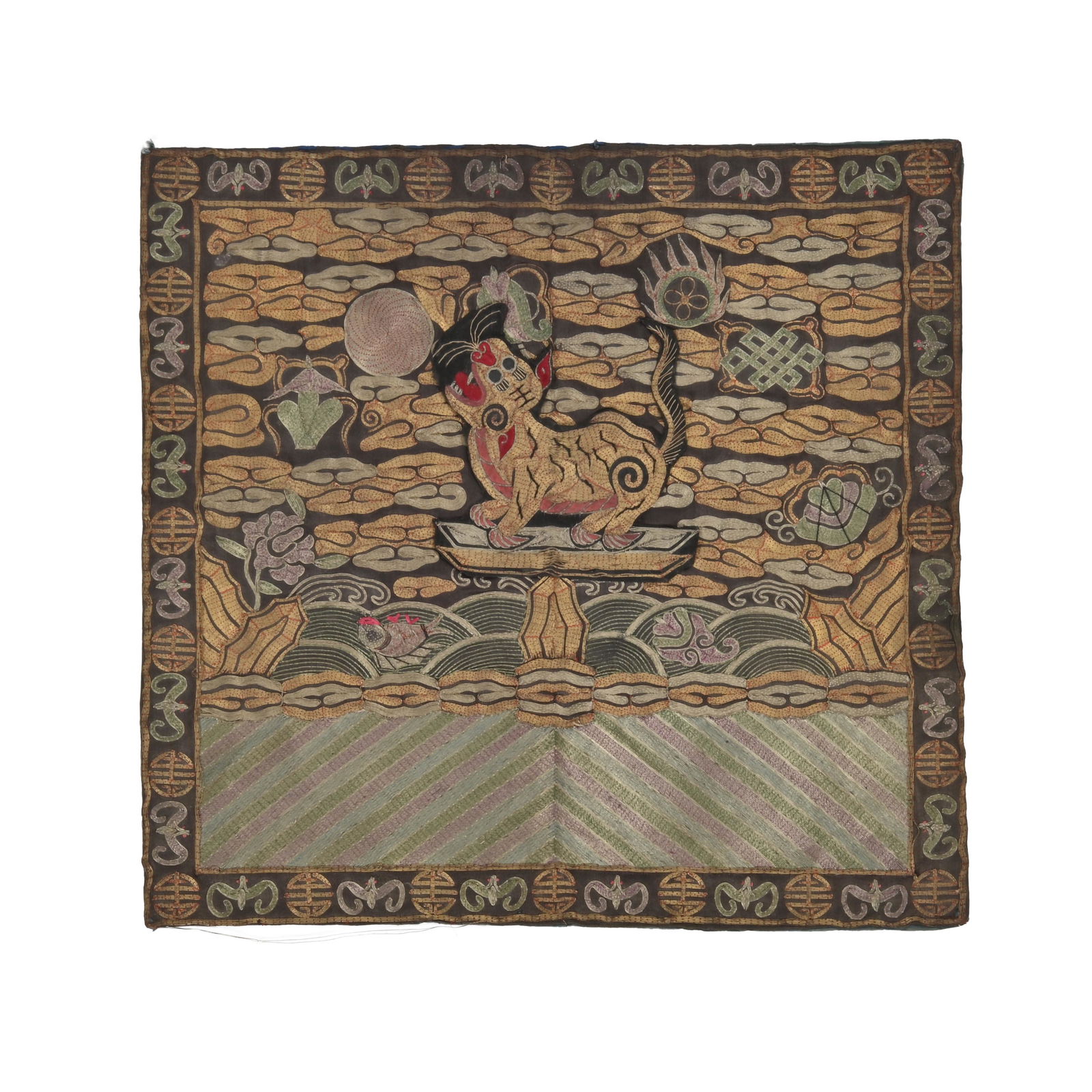 A Chinese 'Tiger' Military Rank Badge.: A Chinese 'Tiger' Military Rank Badge, Ming Dynasty. Designed for a fourth rank military official, worked with silk and couched metallic threads on a dark gray ground, the appliqued tiger with a gapin