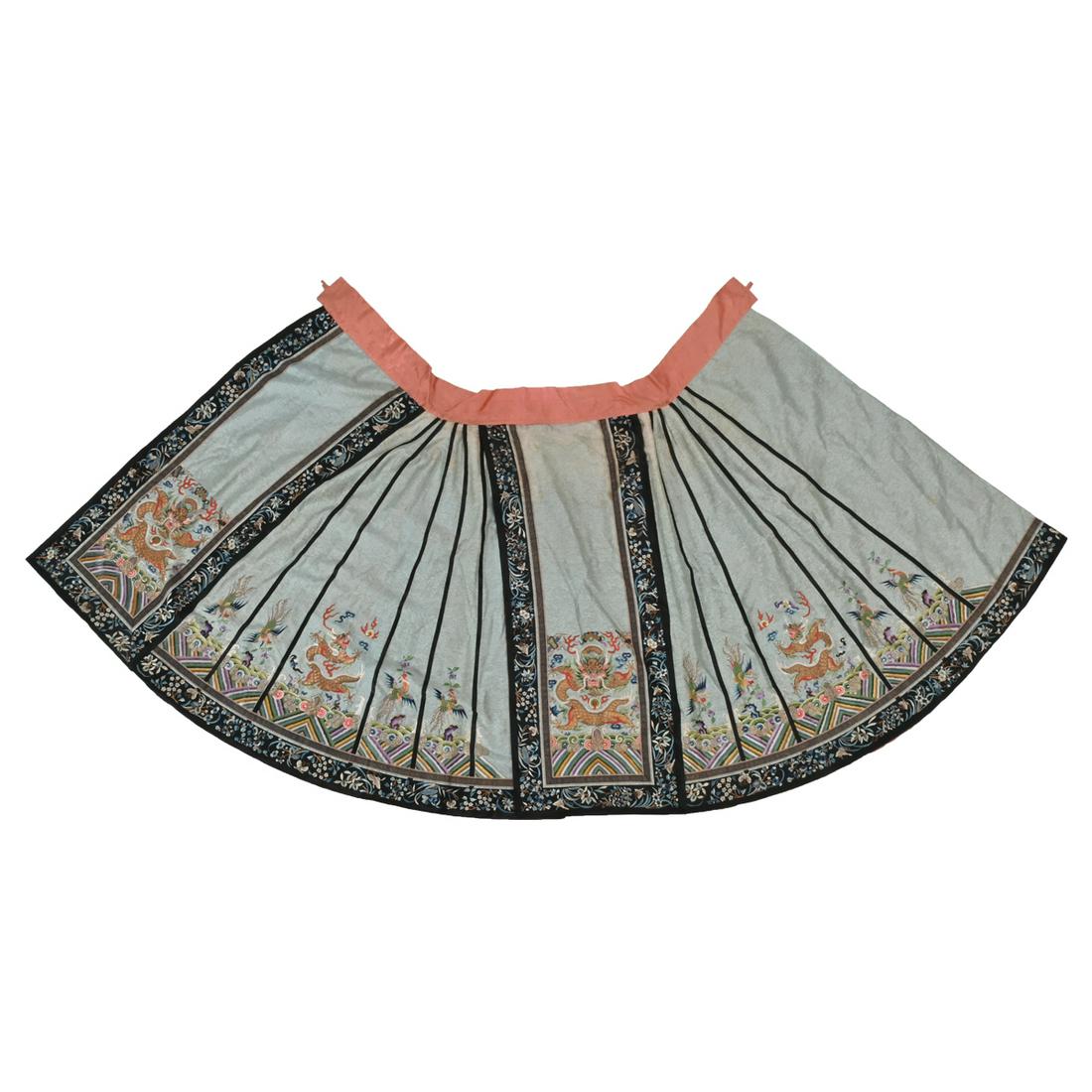 Chinese Embroidered Silk 'Dragon' Skirt.: Chinese Embroidered Silk 'Dragon' Skirt. The pale blue silk ground woven with the Eight Daoist Emblems and embroidered in couched gilt and polychrome stain stitches depicting five-clawed dragons and p