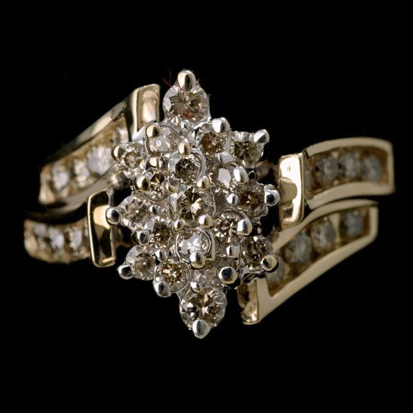 DIAMOND, 10K YELLOW GOLD RING.: DIAMOND, 10K YELLOW GOLD RING. Featuring thirty-five full-cut diamonds weighing a total of approximately 1.00ct, prong and channel set in a 10k yellow gold mounting. 3.2 dwts. Size 7.