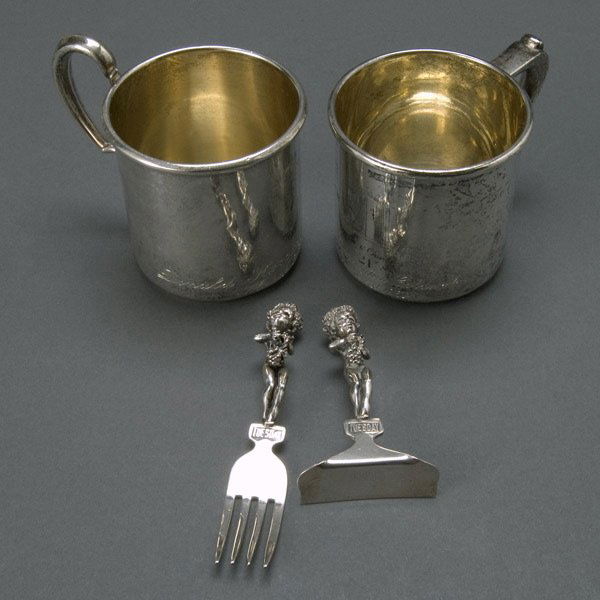 Four Sterling Items: two baby cups & two utensils: Four Sterling Items: two baby cups with engraving "Jack & Charlie's "21" Donald Harrington Goldwater March 22, 1955" and "Sally Harrington Goldwater November 11, 1952", one cup stamped Frank S. Pratt;