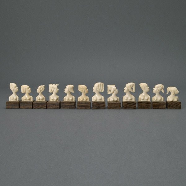 Twelve Carved Ivory Place Card Holders, Zaire: Set of Twelve Carved Ivory Place Card Holders, with wood bases, Zaire Africa {Height including base 2 1/2 inches}