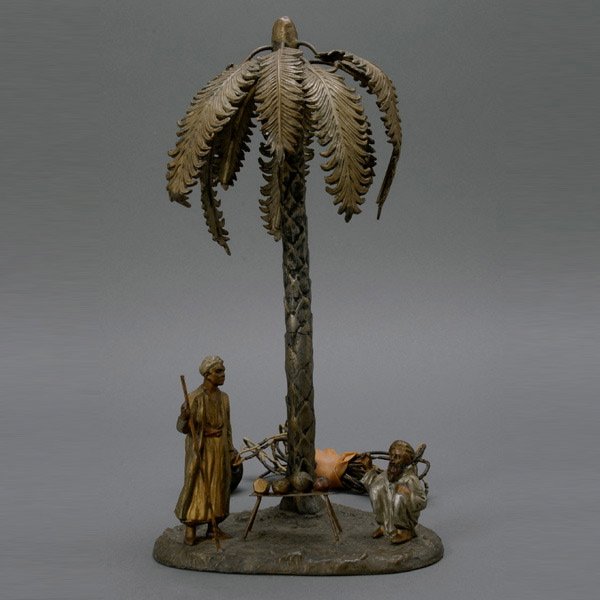 Austrian Cold Painted Palm Tree Bronze Lamp: Austrian Cold Painted Bronze Lamp in Middle Eastern Taste, Early 20th Century, a palm tree forming the shade for a single light and a canopy for two figures of Arab men, one of a shepherd and the othe