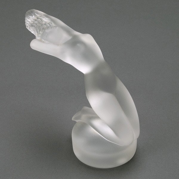 Lalique France Chrysis Frosted Glass Figure: Lalique France Chrysis Frosted Glass Figure, this car mascot model was introduced in 1931, catalogue #1183 {Height 5 1/2 inches} [Two small mars on back, otherwise good condition]