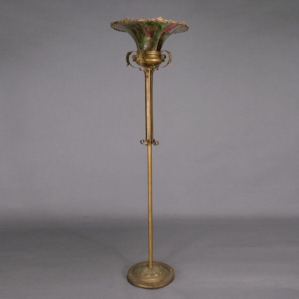 American Leaded Glass Floor Lamp, Circa 1915: American Leaded Glass Floor Lamp, Circa 1915, with cylindrical standard, the shade consisting of curviate striated green and red chipped glass panels, the flaring rim with gilt and applied waterlily m