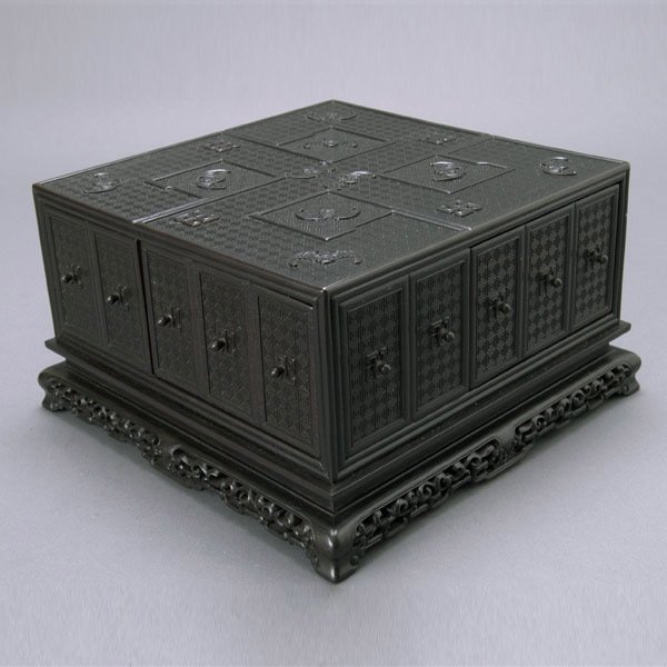 Chinese ZiTan Wood Box, 20th Century: Chinese ZiTan Wood Box, 20th Century. Square form decorated with bats and swastikas to a geometric patterned ground, each side with one side drawer containing four compartments inside, fixed to an ope
