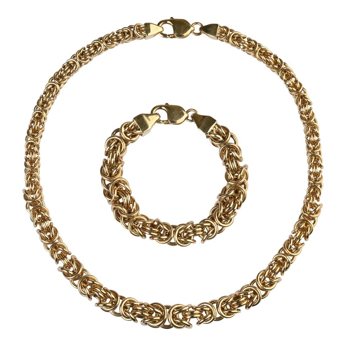 14k Yellow Gold Jewelry Suite.: 14k Yellow Gold Jewelry Suite. Including one 14k yellow gold Byzantine link tapering from 11 mm to 7 mm, 17 inch necklace together with a matching 14k yellow gold Byzantine link measuring approximatel