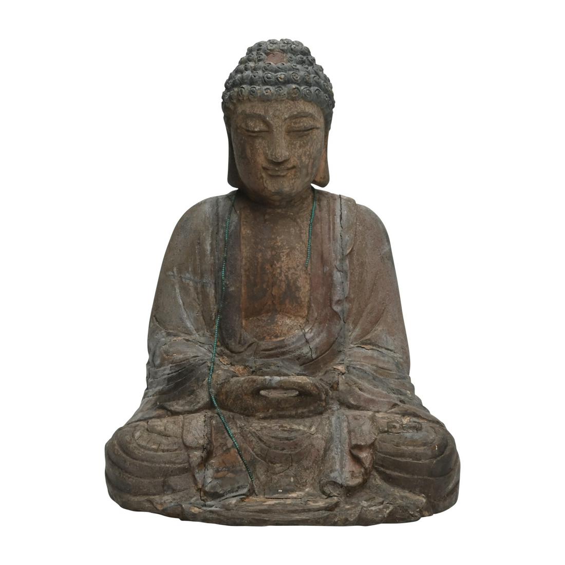 Wood Carved and Painted Seated Buddha: Wood Carved and Painted Seated Buddha. Modeled seated in dhyanasana with the hands held together on the lap, wearing loose fitting attire open at the chest, the face bearing downcast eyes and benevole