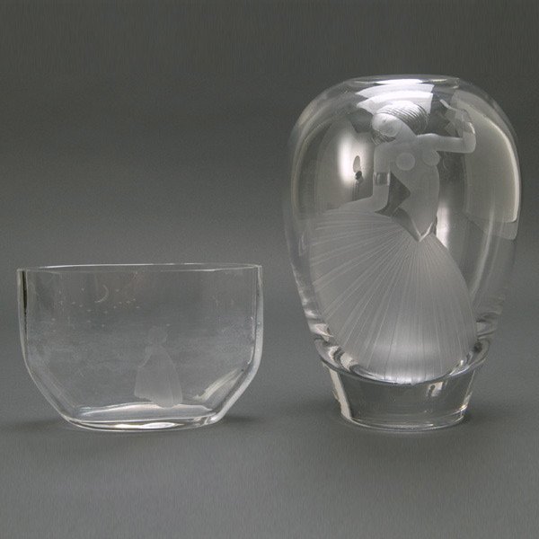 Two Orrefors Engraved Glass Vases: Two Orrefors Engraved Glass Vases: a Deco style partially nude dancer, engraved "Lindstrand 1648 A.Y.S.R."; and a "Twinkle Little Star" vase, "Orrefors F 2769 S" {Height of taller 9 inches, height of 
