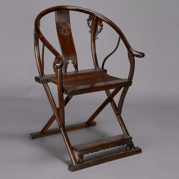 Chinese Folding Rosewood Horseshoe Armchair, 19thC: Chinese Folding Rosewood Horseshoe Armchair, 19th Century. Traditional design with carved dragon form crest highlighting the center back, rectangular collapsible seat made of several wooden cylindrica