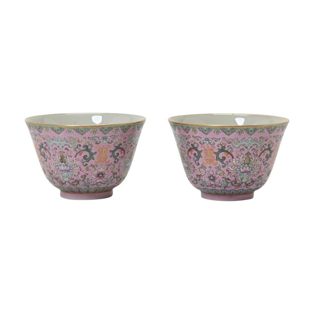 Pair of Pink-Ground Famille Rose Bowls.: Pair of Chinese Pink-Ground Famille Rose Bowls. Each enameled on the exterior with four gilt 'shou' characters amidst stylized lotus scrolls, between a band of ruyi pendants on the mouth and lotus lap