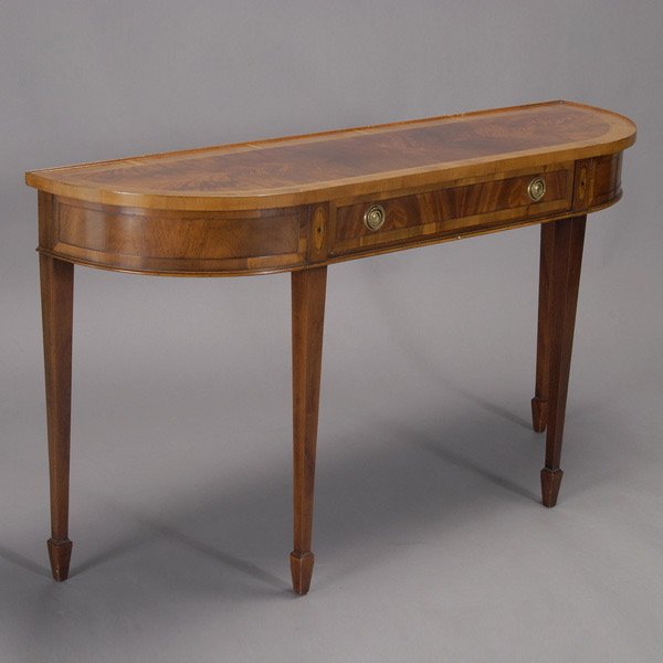 George III Style Inlaid Mahogany Hunt Sideboard: George III Style Inlaid Mahogany Hunt Sideboard The elongated demi-lune top crossbanded with flame mahogany veneer over a recessed frieze with fan inlay, raised on square stile legs with spade feet. {