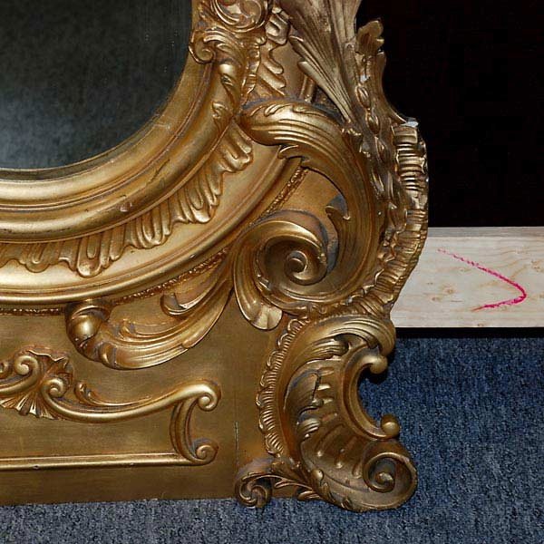 Rococo Revival Gilt Wood Pier Mirror: Rococo Revival Gilt Wood Pier Mirror The arched mirrorplate with a burnished gilt arch pediment centering a elaborate rocaille medallion, each side decorated with ovolo molded sides with an inner leaf