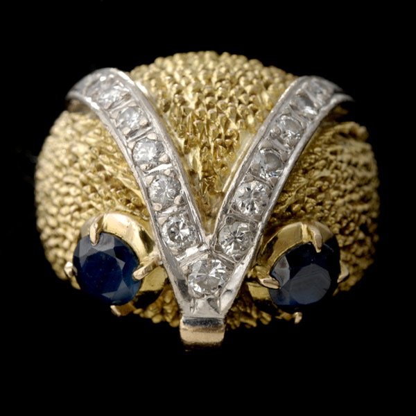 SAPPHIRE, DIAMOND, 14K YELLOW GOLD OWL RING.: SAPPHIRE, DIAMOND, 14K YELLOW GOLD OWL RING. Designed as an owl's face, featuring two round-cut sapphires weighing a total of approximately 0.30ct, accented by thirteen full-cut diamonds weighing a to