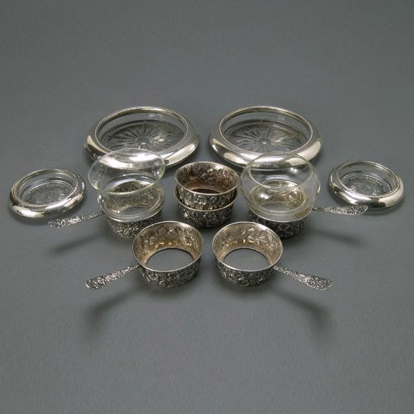 Six Sterling Floral Repousse Ramekins & Coasters: Six Sterling Floral Repousse Ramekins (four with handles); together with four silver mounted coasters, with two glass inserts (12) {Total silver weight 8.20 troy oz; diameter of larger coaster 6 3/4 i
