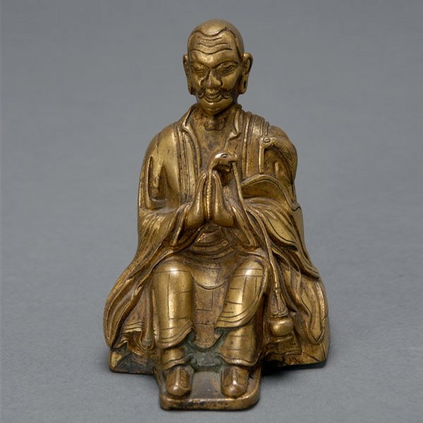 Chinese Gilt Bronze Buddha, Late Qing Dynasty: Chinese Gilt Bronze Figure of Shang ShiZhe Buddha, Late Qing Dynasty. Robed form sits upon a rectangular cushion with hands held together in prayer, a serpent form rises from hands with incense burner