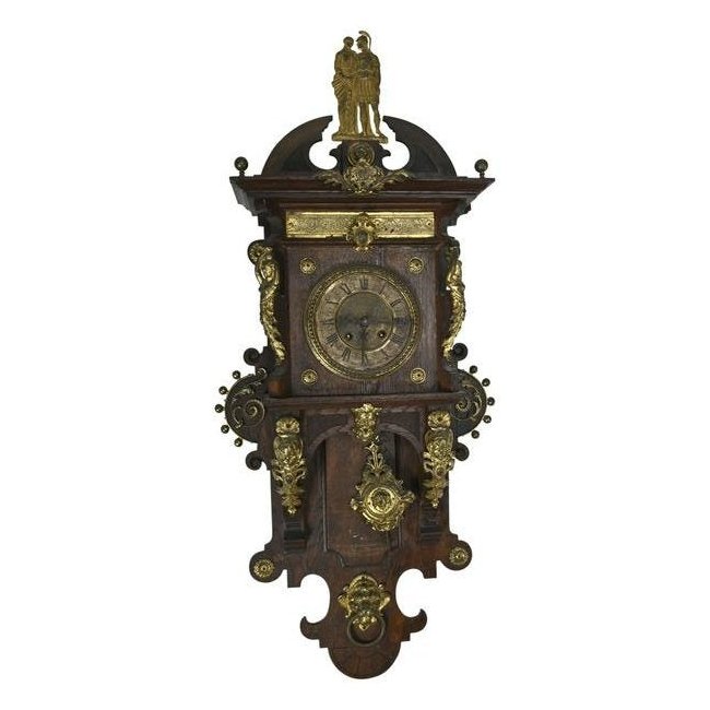 Dutch Mannerist Style Wall Clock.: Dutch Mannerist Style Wall Clock. With gilt metal mounts throughout. Badge below the crown reads 'SALVE'. {Approximate dimensions: 39 1/4 high x 17 1/2 inches wide.}. Condition: Patina and rubbing to 