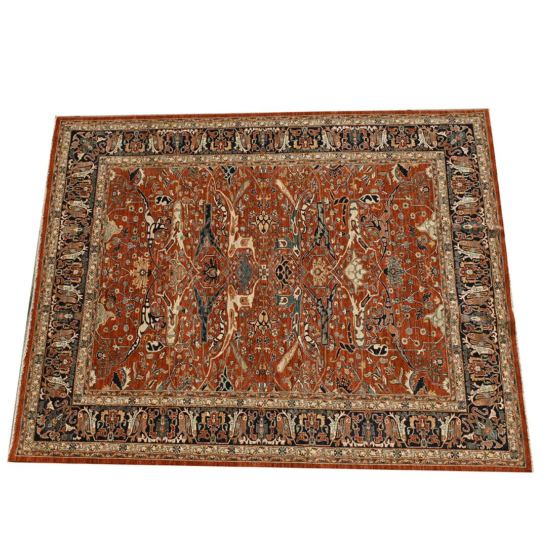 Sultanabad Style Carpet.: Sultanabad Style Carpet. Red ground with dark blue main border, double guard border in light blue and cream, foliate motif throughout. 'MADE IN PAKISTAN' label to the corner. {Approximate dimensions: 