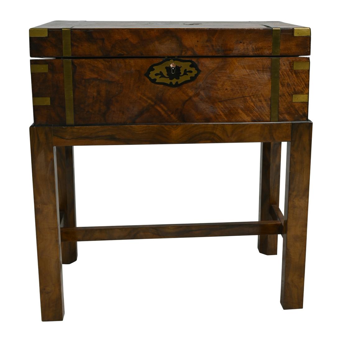 Victorian Burl Mahogany and Brass Inlaid Travel Desk on: Victorian Burl Mahogany and Brass Inlaid Travel Desk on Later Stand. The brass inlaid exterior with brass bands and corners, opens to reveal am inset green tooled leather writing surface, later mahoga
