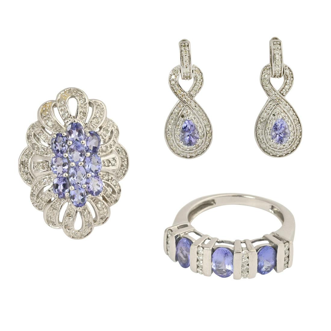 Tanzanite, Diamond, White Gold Jewelry Suite.: Tanzanite, Diamond, White Gold Jewelry Suite. Including one tanzanite, diamond, 14k white gold ring, size 7 1/4; one alternating diamond, tanzanite, 14k white gold ring, size 7 together with a pair of