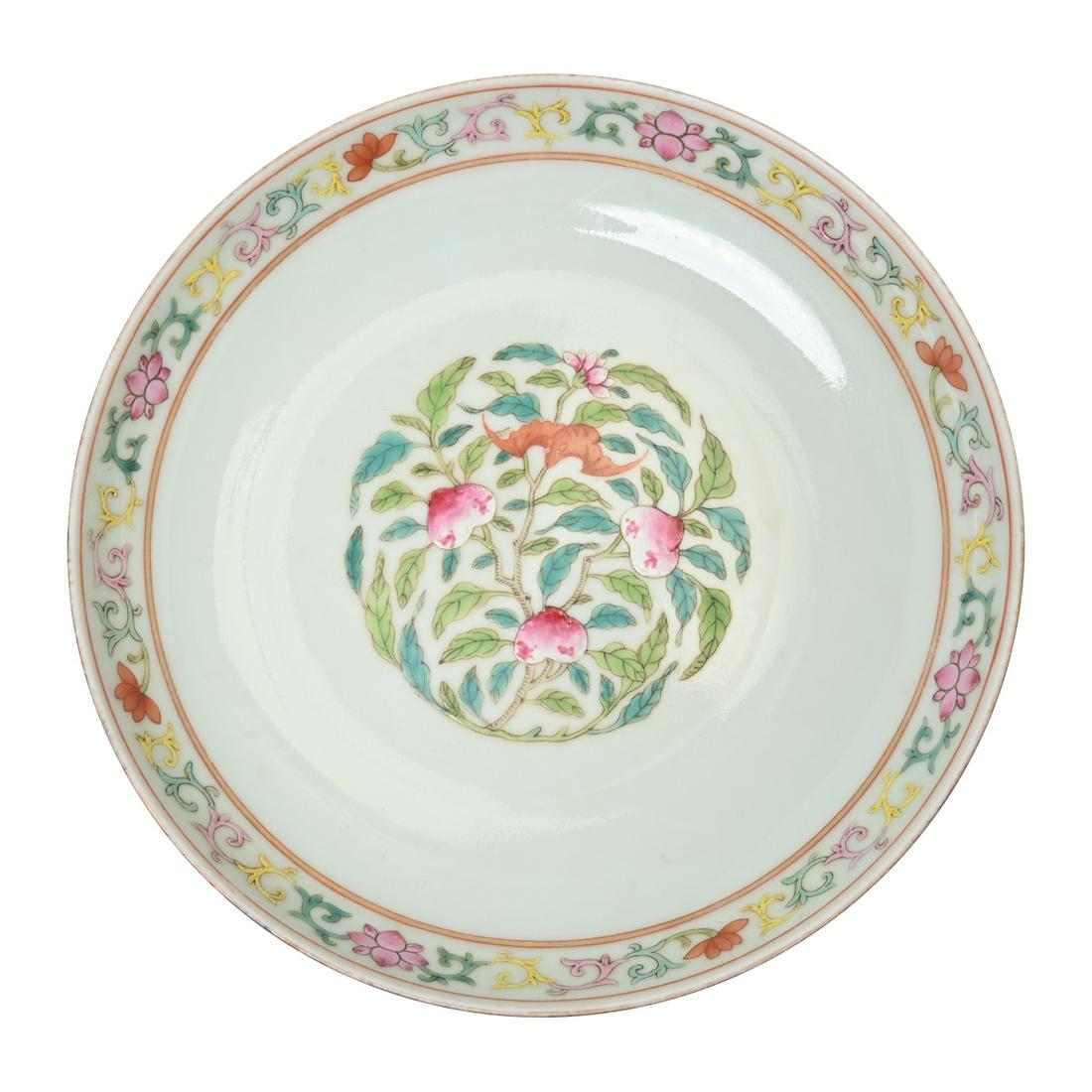 A Famille Rose Porcelain Bat and Peach Dish.: A Famille Rose Porcelain Bat and Peach Dish. The shallow rounded sides rising from a short tapering foot, the interior painted with three peaches and a bat in circled leaves, the continuous lotus band